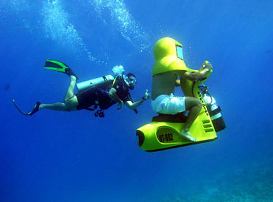 From http://inhabitat.com/aqua-star-underwater-electric-scooter-makes-passengers-look-like-yellow-darth-vaders/